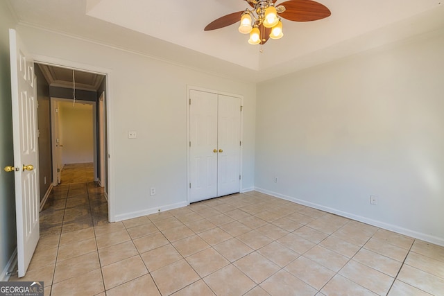 230 Hidden Brook Trl, Fayetteville, GA 30215 - unfurnished bedroom featuring attic access, light tile patterned floors, ornamental molding, baseboards, and a closet