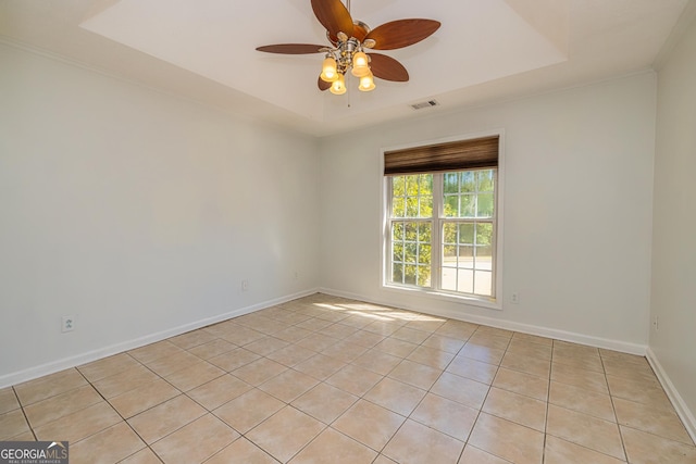 230 Hidden Brook Trl, Fayetteville, GA 30215 - spare room featuring light tile patterned floors, a tray ceiling, a ceiling fan, and baseboards