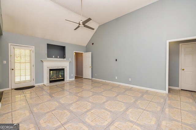 230 Hidden Brook Trl, Fayetteville, GA 30215 - unfurnished living room with high vaulted ceiling, ceiling fan, a premium fireplace, baseboards, and light tile patterned flooring