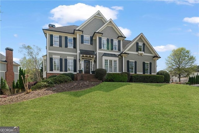 295 Sagamore Cv NW, Sugar Hill, GA 30518 - view of front of house with a front lawn and a chimney