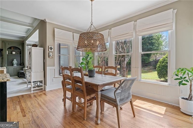 295 Sagamore Cv NW, Sugar Hill, GA 30518 - dining space featuring crown molding, light wood-type flooring, and a wainscoted wall