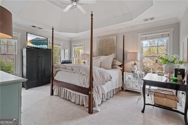 295 Sagamore Cv NW, Sugar Hill, GA 30518 - bedroom with light colored carpet, ornamental molding, a raised ceiling, and a ceiling fan
