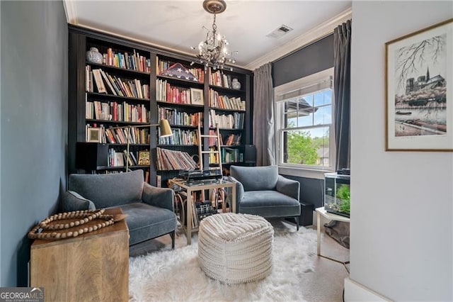 living area with a chandelier and crown molding