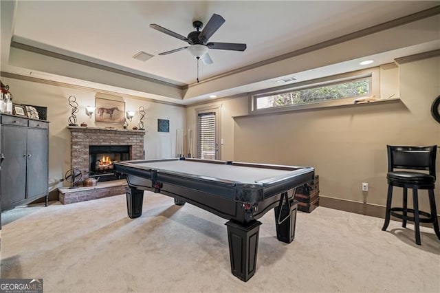 295 Sagamore Cv NW, Sugar Hill, GA 30518 - rec room with ornamental molding, carpet floors, a fireplace, a tray ceiling, and baseboards