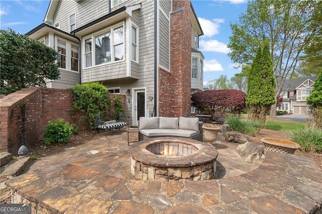295 Sagamore Cv NW, Sugar Hill, GA 30518 - view of patio with an outdoor fire pit