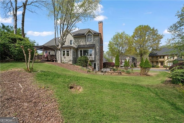 295 Sagamore Cv NW, Sugar Hill, GA 30518 - back of house featuring a chimney and a lawn
