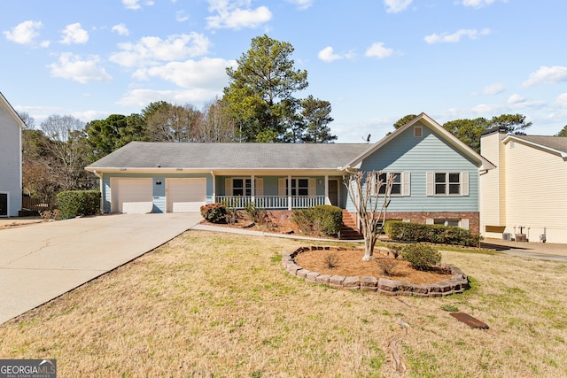 ranch-style home featuring a front yard, a porch, driveway, and an attached garage