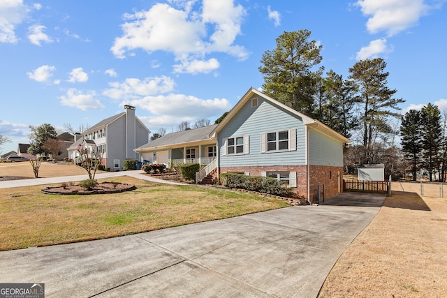 view of front of house featuring concrete driveway, covered porch, a front lawn, and brick siding