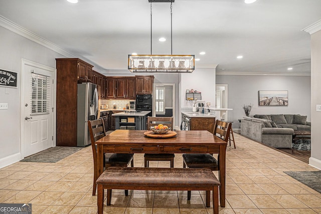 dining area featuring recessed lighting, crown molding, and light tile patterned floors