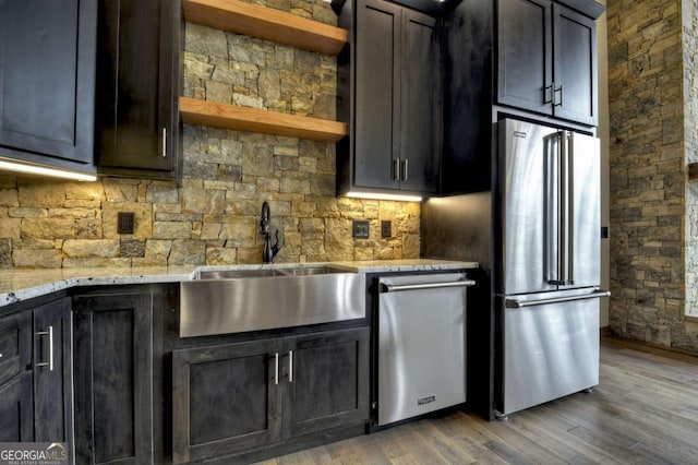 768 Cherokee Cir, Ellijay, GA 30540 - kitchen featuring open shelves, light stone countertops, stainless steel appliances, a sink, and wood finished floors