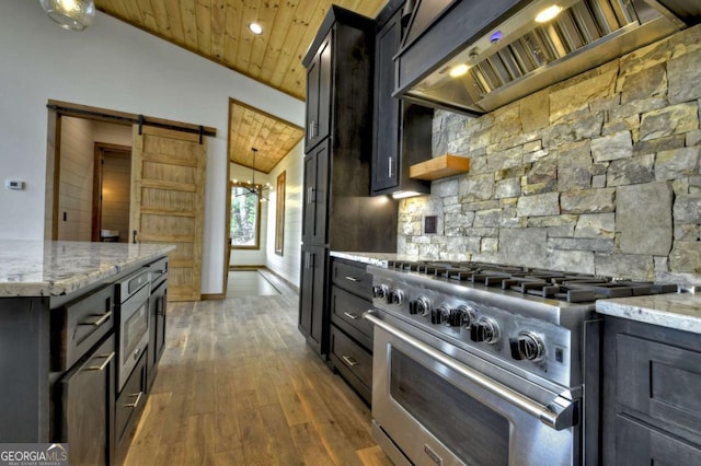 768 Cherokee Cir, Ellijay, GA 30540 - kitchen with high end range, wooden ceiling, wood finished floors, light stone counters, and premium range hood