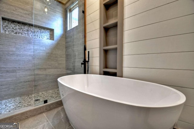 768 Cherokee Cir, Ellijay, GA 30540 - bathroom featuring a freestanding tub, wooden walls, a tile shower, and tile patterned flooring