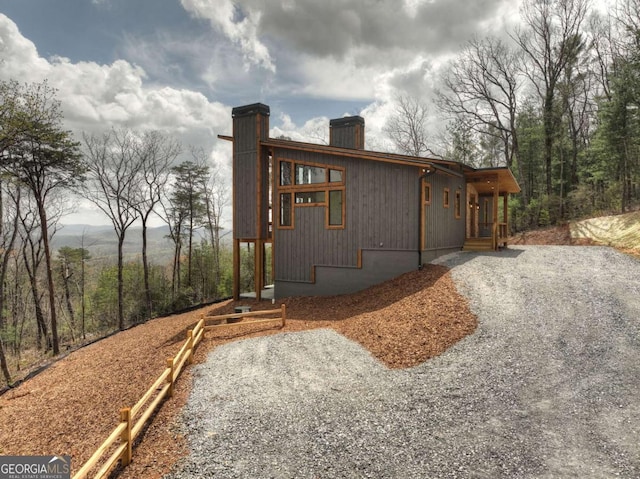 768 Cherokee Cir, Ellijay, GA 30540 - view of home's exterior featuring driveway and a chimney