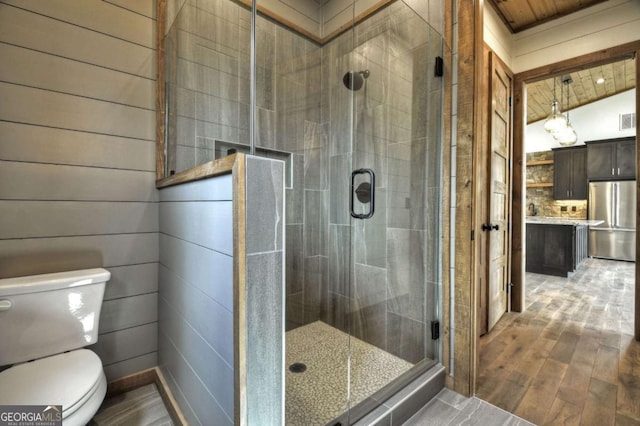 768 Cherokee Cir, Ellijay, GA 30540 - bathroom with toilet, wood ceiling, a shower stall, vanity, and wood finished floors