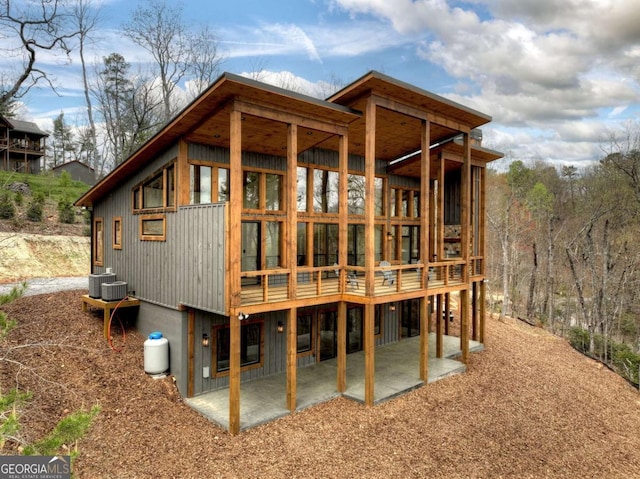768 Cherokee Cir, Ellijay, GA 30540 - rear view of house featuring a patio area and central AC unit