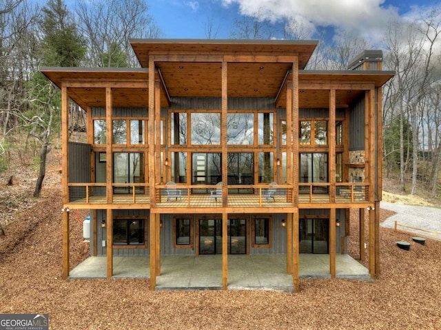 768 Cherokee Cir, Ellijay, GA 30540 - back of house with a patio, a deck, and board and batten siding
