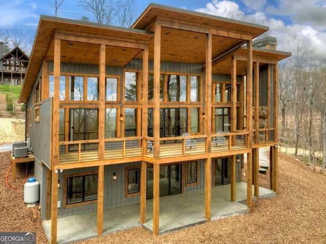768 Cherokee Cir, Ellijay, GA 30540 - rear view of property with central air condition unit, board and batten siding, a patio area, and a wooden deck
