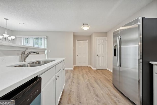 1575 April Ln, Morrow, GA 30260 - kitchen with stainless steel fridge, light wood-style flooring, white cabinetry, dishwashing machine, and a sink