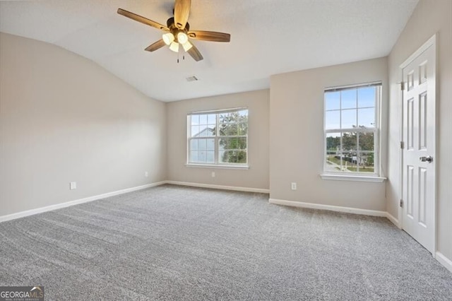 1575 April Ln, Morrow, GA 30260 - empty room featuring carpet, ceiling fan, baseboards, and lofted ceiling