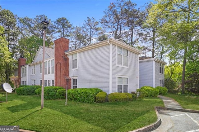 4307 Orchard Park Ct Unit A, Stone Mountain, GA 30083 - view of side of property with a lawn and a chimney
