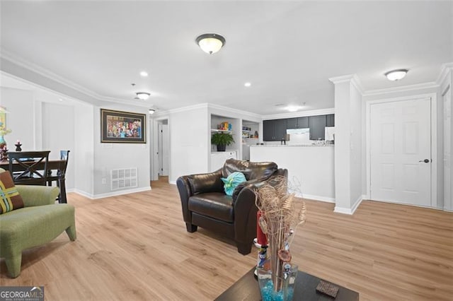 4307 Orchard Park Ct Unit A, Stone Mountain, GA 30083 - living room featuring crown molding, light wood finished floors, and recessed lighting