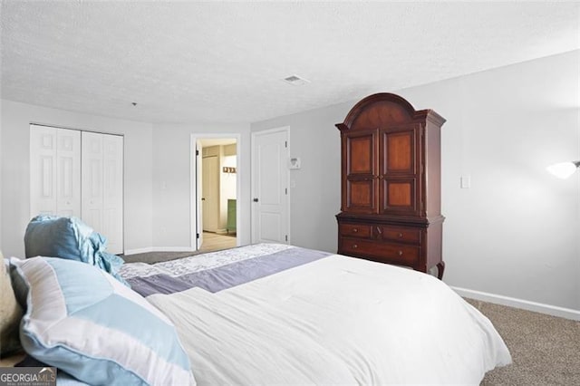 4307 Orchard Park Ct Unit A, Stone Mountain, GA 30083 - carpeted bedroom with a closet and a textured ceiling