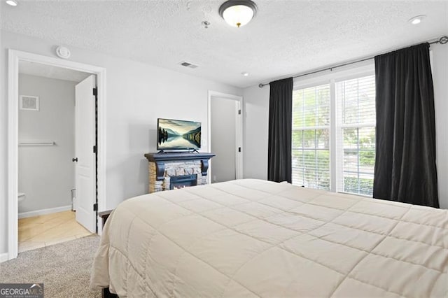 4307 Orchard Park Ct Unit A, Stone Mountain, GA 30083 - carpeted bedroom with a textured ceiling, tile patterned floors, and recessed lighting