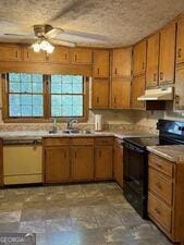 4528 Newcastle Cir, Lithonia, GA 30038 - kitchen featuring black electric range oven, ceiling fan, under cabinet range hood, dishwashing machine, and light countertops