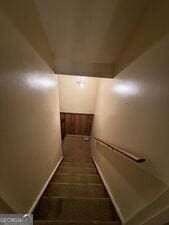 4528 Newcastle Cir, Lithonia, GA 30038 - staircase featuring baseboards