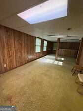 4528 Newcastle Cir, Lithonia, GA 30038 - bonus room featuring wooden walls
