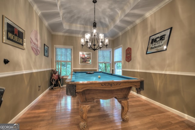 rec room with plenty of natural light, crown molding, a tray ceiling, billiards, and wood finished floors