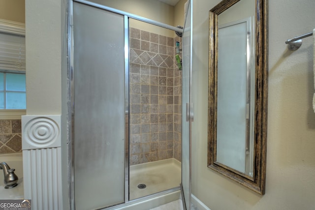 full bathroom featuring a stall shower