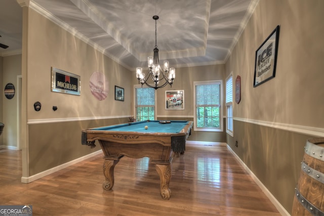 recreation room featuring pool table, a chandelier, crown molding, a raised ceiling, and wood finished floors