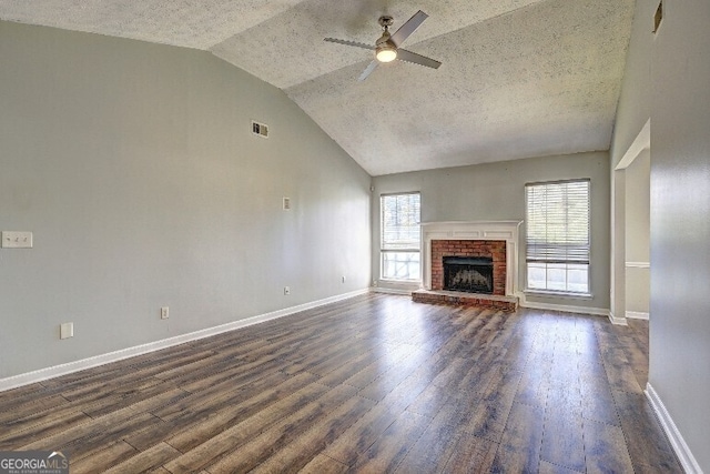 unfurnished living room featuring dark wood-type flooring, baseboards, a ceiling fan, and lofted ceiling