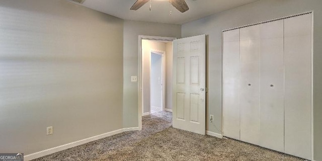 unfurnished bedroom featuring a closet, ceiling fan, baseboards, and carpet