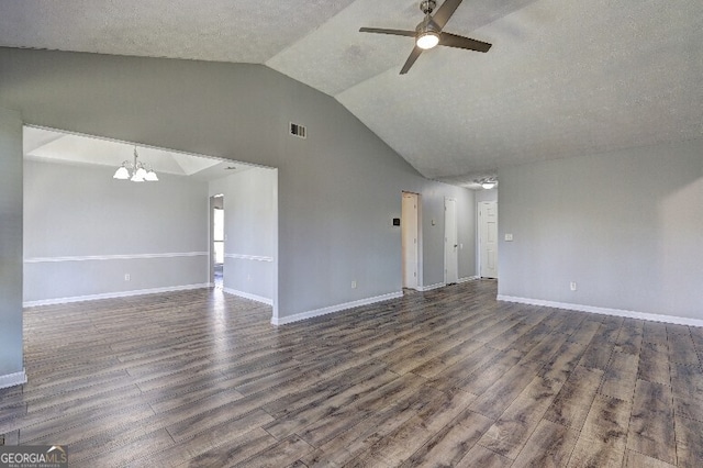 unfurnished living room with dark wood-style flooring, ceiling fan with notable chandelier, visible vents, and lofted ceiling
