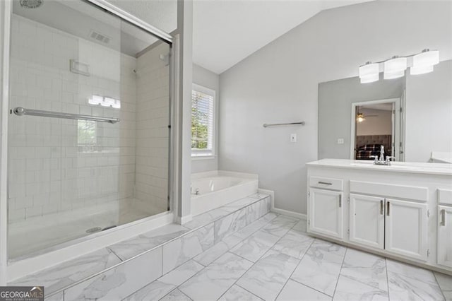 full bath with a shower stall, a garden tub, marble finish floor, and lofted ceiling