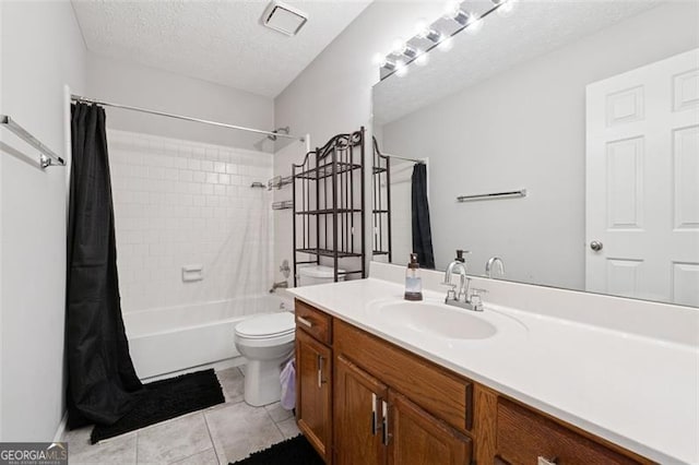 full bath featuring vanity, shower / bath combo, tile patterned floors, a textured ceiling, and toilet