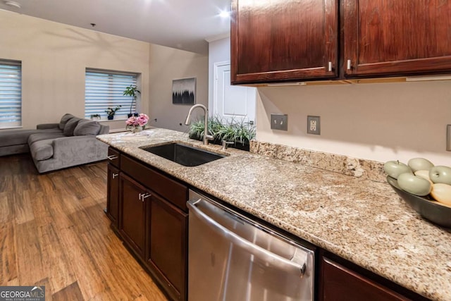 2626 Peachtree Rd NW Unit 412, Atlanta, GA 30305 - kitchen with a sink, wood finished floors, dishwasher, and light stone countertops