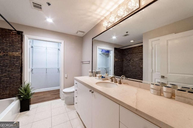 2626 Peachtree Rd NW Unit 412, Atlanta, GA 30305 - bathroom featuring a tile shower, tile patterned floors, vanity, and visible vents