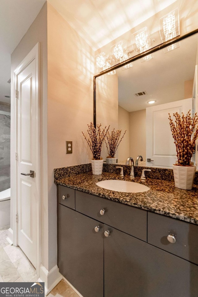 2626 Peachtree Rd NW Unit 412, Atlanta, GA 30305 - bathroom with marble finish floor, vanity, baseboards, and visible vents