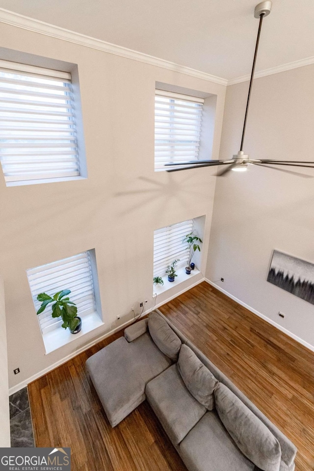 2626 Peachtree Rd NW Unit 412, Atlanta, GA 30305 - living area with ornamental molding, baseboards, a ceiling fan, and wood finished floors