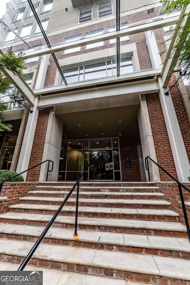 2626 Peachtree Rd NW Unit 412, Atlanta, GA 30305 - property entrance featuring brick siding and a balcony