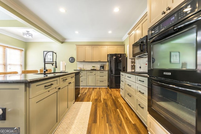 kitchen featuring dark wood-type flooring, ornamental molding, black appliances, a sink, and decorative backsplash