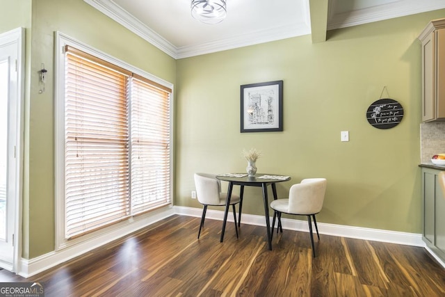 dining space featuring ornamental molding, plenty of natural light, and dark wood-style floors