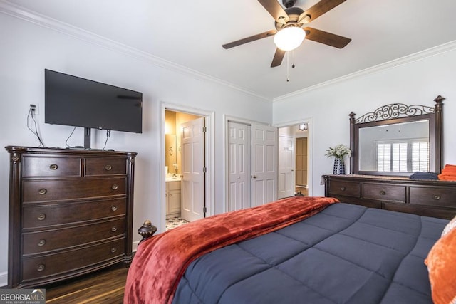 bedroom featuring dark wood-style flooring, ornamental molding, connected bathroom, and ceiling fan