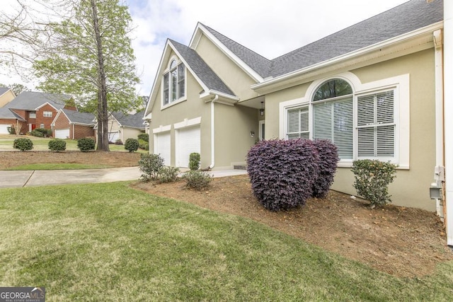 view of property exterior with roof with shingles, a garage, stucco siding, and driveway