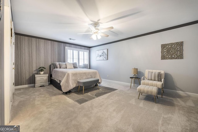 bedroom with carpet flooring, ornamental molding, and visible vents