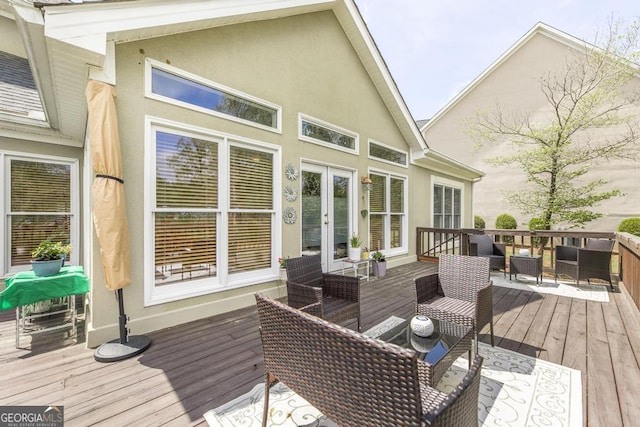 deck featuring an outdoor living space and french doors
