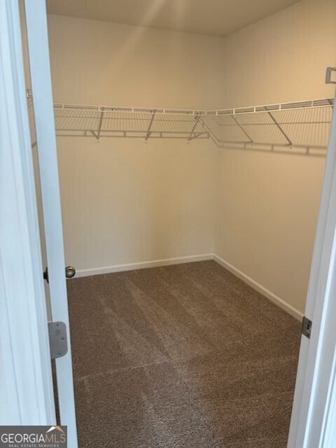 182 Parkwood Dr Unit 32, Dawsonville, GA 30534 - spacious closet featuring dark colored carpet